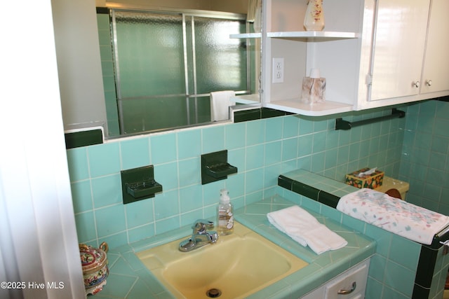 2945 US Highway 17, Williamston, NC 27892 - bathroom featuring a shower with door, vanity, tile walls, and backsplash