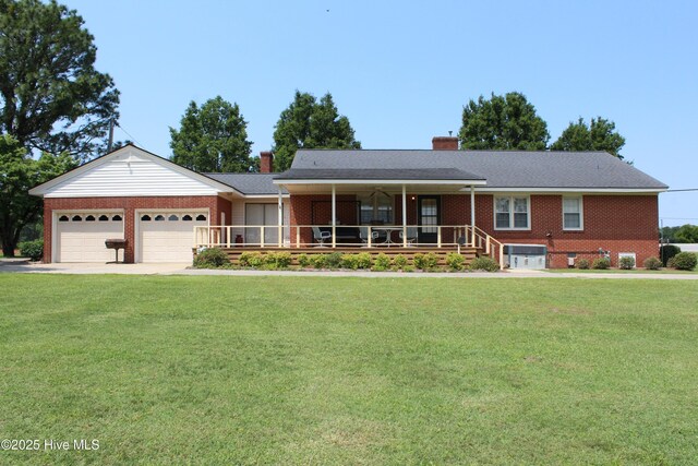 2945 US Highway 17, Williamston, NC 27892 - single story home featuring brick siding, a front lawn, a garage, and a chimney