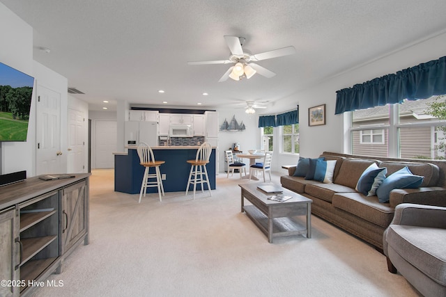 3030 Marsh Winds Cir Unit 605, Southport, NC 28461 - living area with ceiling fan, light colored carpet, and recessed lighting