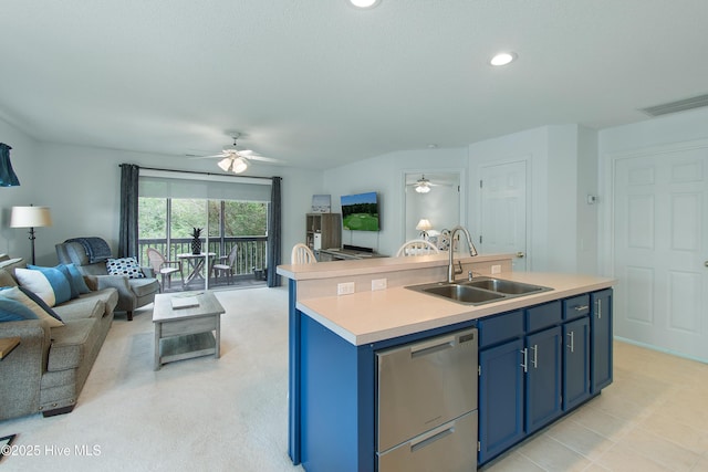 3030 Marsh Winds Cir Unit 605, Southport, NC 28461 - kitchen with dishwasher, a sink, open floor plan, blue cabinetry, and a ceiling fan