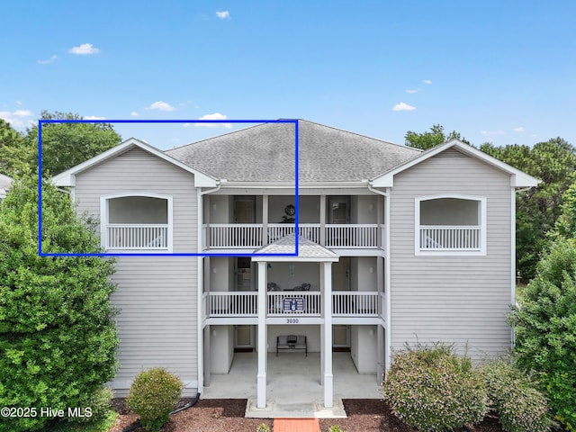 3030 Marsh Winds Cir Unit 605, Southport, NC 28461 - rear view of house with a shingled roof