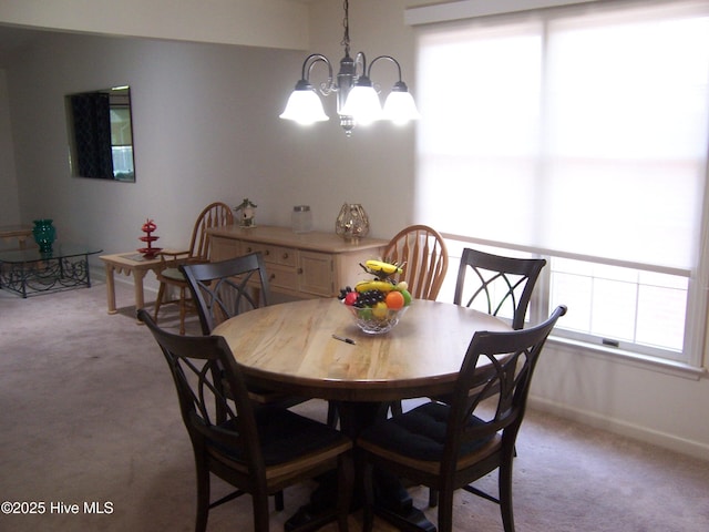 145 Pinehurst Trace Dr, Pinehurst, NC 28374 - dining room with light carpet, a chandelier, and baseboards