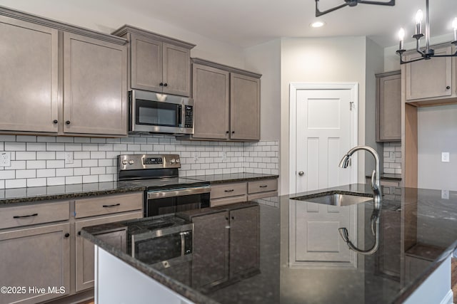 355 Shaw Rd, Cameron, NC 28326 - kitchen featuring stainless steel appliances, dark stone counters, tasteful backsplash, a sink, and recessed lighting