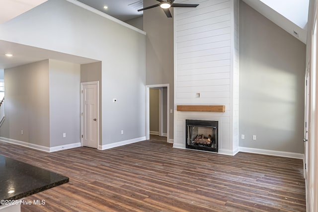 355 Shaw Rd, Cameron, NC 28326 - unfurnished living room featuring high vaulted ceiling, a ceiling fan, baseboards, dark wood-style floors, and a fireplace