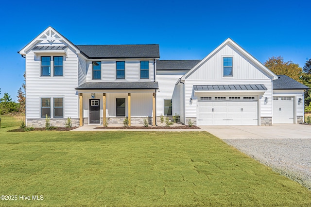355 Shaw Rd, Cameron, NC 28326 - modern farmhouse featuring stone siding, a standing seam roof, driveway, a front yard, and roof with shingles
