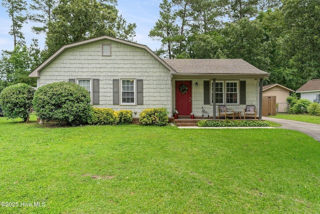 225 Candlewood Dr, Wilmington, NC 28411 - view of front facade featuring a porch, a shingled roof, and a gambrel roof