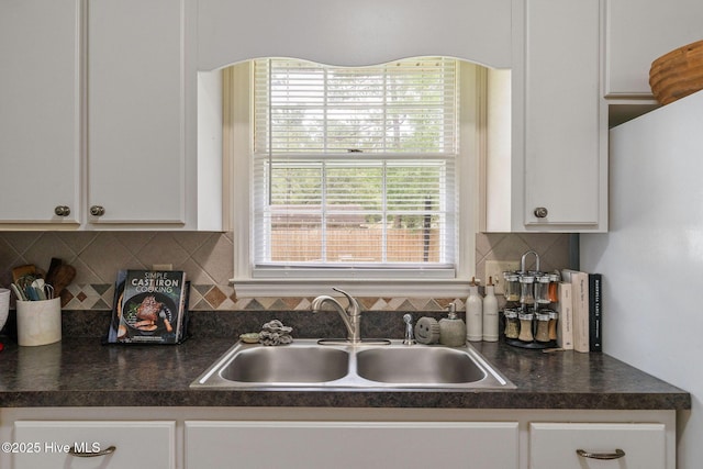 225 Candlewood Dr, Wilmington, NC 28411 - kitchen featuring dark countertops and white cabinets
