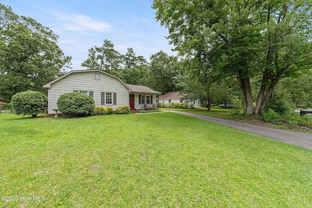 225 Candlewood Dr, Wilmington, NC 28411 - view of front facade featuring a front yard and driveway