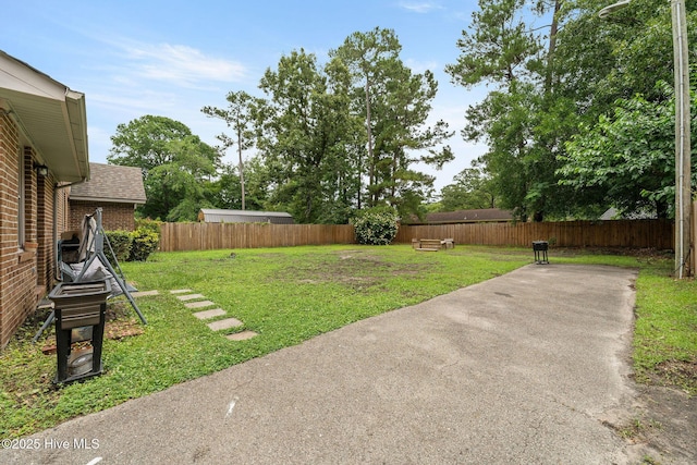225 Candlewood Dr, Wilmington, NC 28411 - fenced backyard with a patio