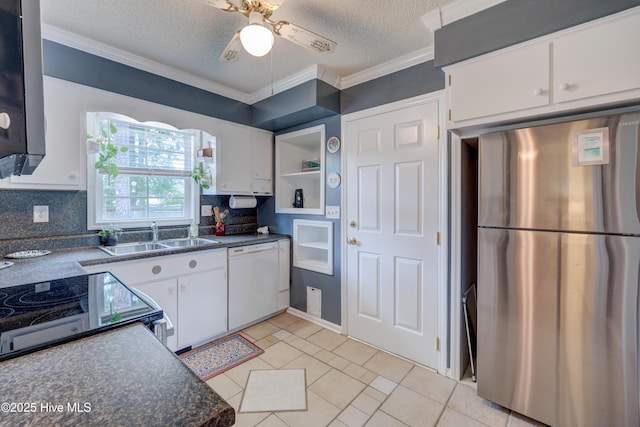 1525 Pointer Ln, Wilmington, NC 28411 - kitchen featuring freestanding refrigerator, white dishwasher, ornamental molding, white cabinets, and dark countertops