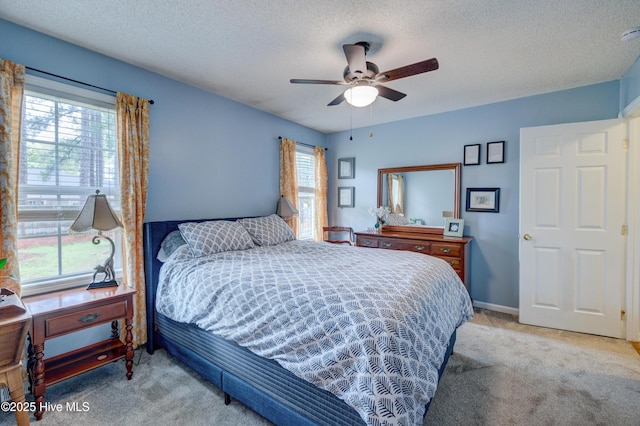 1525 Pointer Ln, Wilmington, NC 28411 - bedroom featuring carpet, a textured ceiling, and ceiling fan
