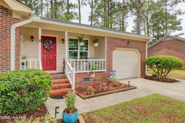 1525 Pointer Ln, Wilmington, NC 28411 - doorway to property featuring concrete driveway, covered porch, a garage, and brick siding
