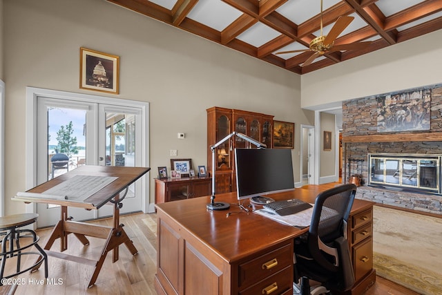 4 Lake Shore Ct, Pinehurst, NC 28374 - office with light wood finished floors, a fireplace, coffered ceiling, a high ceiling, and a ceiling fan