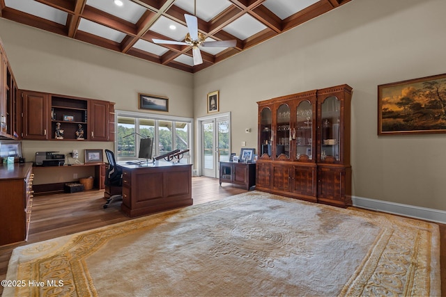 4 Lake Shore Ct, Pinehurst, NC 28374 - home office with a towering ceiling, wood finished floors, beam ceiling, ceiling fan, and coffered ceiling