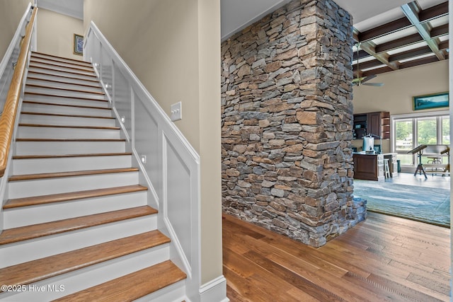 4 Lake Shore Ct, Pinehurst, NC 28374 - stairs featuring hardwood / wood-style floors, beamed ceiling, and a high ceiling
