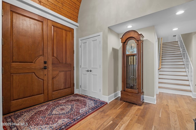 4 Lake Shore Ct, Pinehurst, NC 28374 - entryway with stairs, light wood-style flooring, a towering ceiling, and recessed lighting