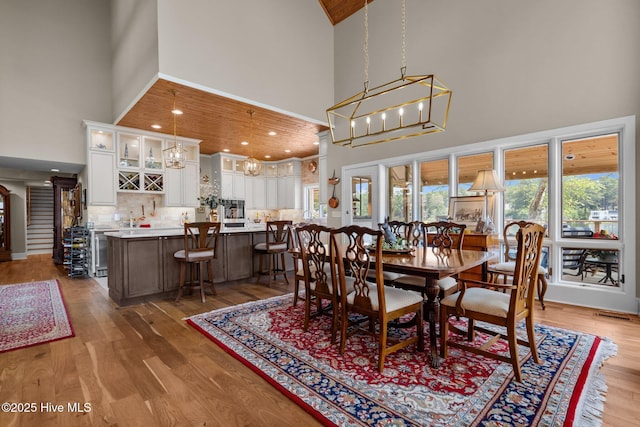 4 Lake Shore Ct, Pinehurst, NC 28374 - dining room with high vaulted ceiling, wood finished floors, and wine cooler