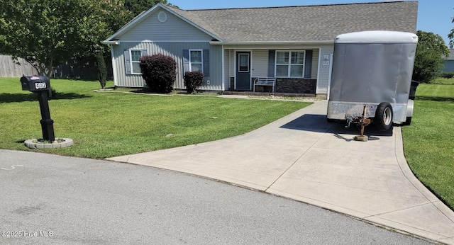 402 Halo Ct, Jacksonville, NC 28546 - view of front of home with a front yard and roof with shingles