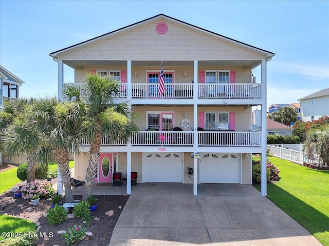 813 Cutter Ct, Kure Beach, NC 28449 - beach home featuring concrete driveway, a balcony, and a garage