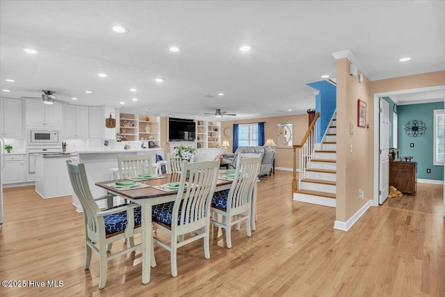 813 Cutter Ct, Kure Beach, NC 28449 - dining space featuring ceiling fan, recessed lighting, light wood-type flooring, and stairway