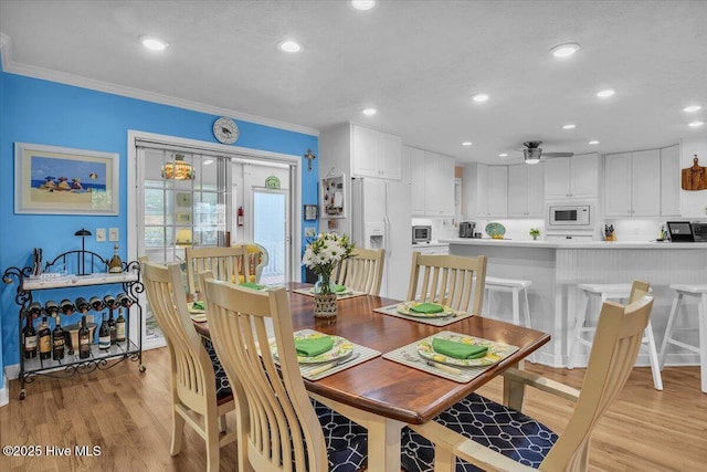 813 Cutter Ct, Kure Beach, NC 28449 - dining room featuring light wood finished floors, ceiling fan, recessed lighting, and ornamental molding