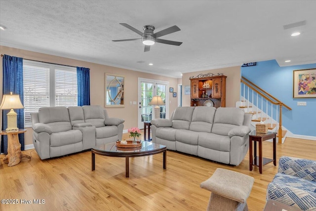 813 Cutter Ct, Kure Beach, NC 28449 - living area featuring ornamental molding, a ceiling fan, light wood-style flooring, stairs, and recessed lighting