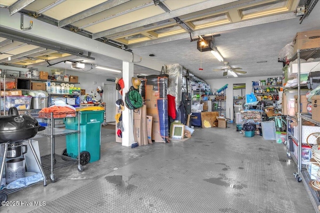 813 Cutter Ct, Kure Beach, NC 28449 - garage with a garage door opener and a ceiling fan