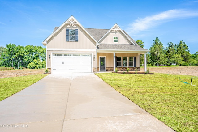 193 Jim S Rd, Cameron, NC 28326 - craftsman-style home featuring driveway, a front yard, an attached garage, and a porch