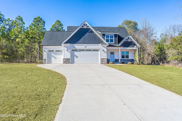 193 Jim S Rd, Cameron, NC 28326 - craftsman-style house featuring stone siding, board and batten siding, a front yard, and driveway