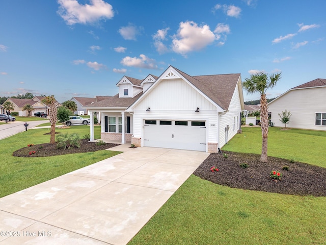 2143 Stonecrest Dr NW, Calabash, NC 28467 - view of front of property with brick siding, a front lawn, an attached garage, concrete driveway, and board and batten siding