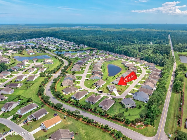 2143 Stonecrest Dr NW, Calabash, NC 28467 - aerial view of residential area featuring a nearby body of water and a forest