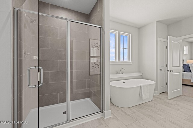 101 Claire Ct, Moyock, NC 27958 - bathroom featuring connected bathroom, a freestanding tub, and a stall shower