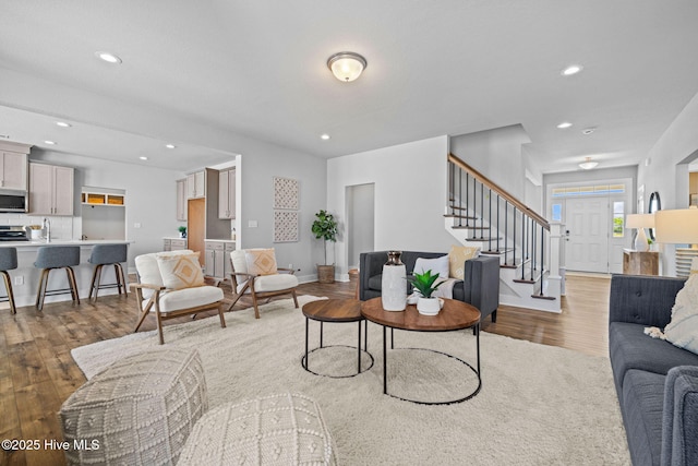 101 Claire Ct, Moyock, NC 27958 - living room featuring stairs, wood finished floors, recessed lighting, and baseboards