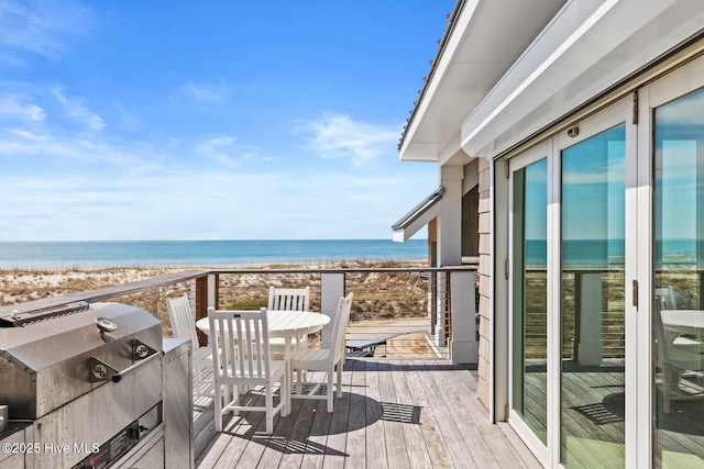 11 Sandspur Trl, Bald Head Island, NC 28461 - balcony with view of water and beach, area for grilling, and outdoor dining area