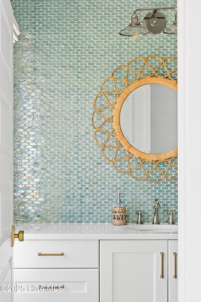 11 Sandspur Trl, Bald Head Island, NC 28461 - bathroom featuring decorative backsplash and vanity