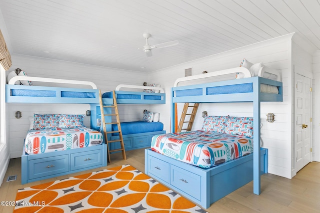 11 Sandspur Trl, Bald Head Island, NC 28461 - bedroom with light wood-style floors and ceiling fan