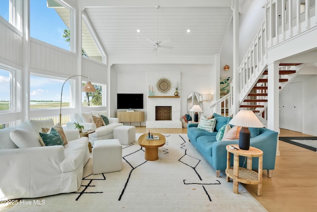 3343 Channelside Dr SW, Supply, NC 28462 - living room with wood finished floors, high vaulted ceiling, a ceiling fan, plenty of natural light, and recessed lighting