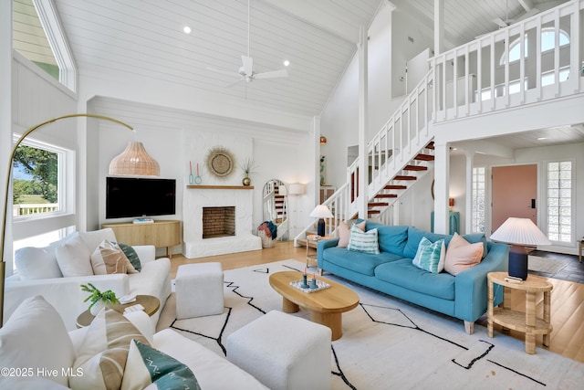 3343 Channelside Dr SW, Supply, NC 28462 - living area featuring high vaulted ceiling, wood finished floors, stairway, a wooden ceiling with exposed beams, and ceiling fan