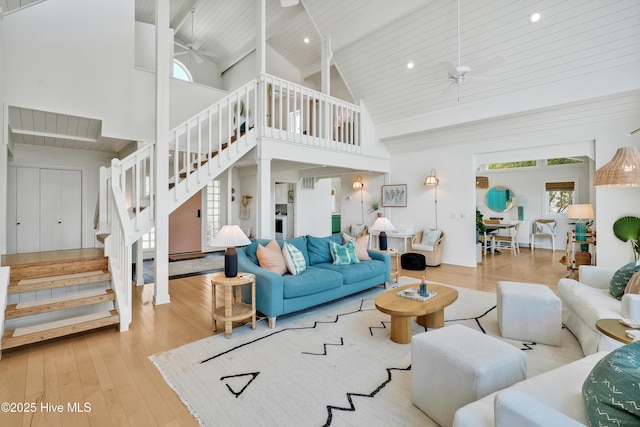 3343 Channelside Dr SW, Supply, NC 28462 - living area with ceiling fan, stairway, high vaulted ceiling, a wooden ceiling with exposed beams, and wood finished floors