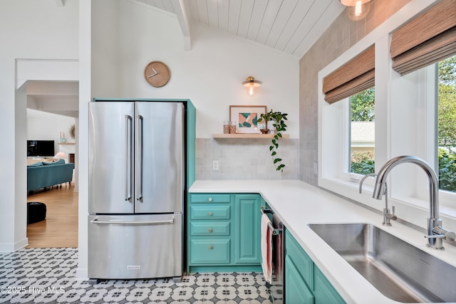 3343 Channelside Dr SW, Supply, NC 28462 - kitchen featuring appliances with stainless steel finishes, an office area, light countertops, wooden ceiling, and backsplash