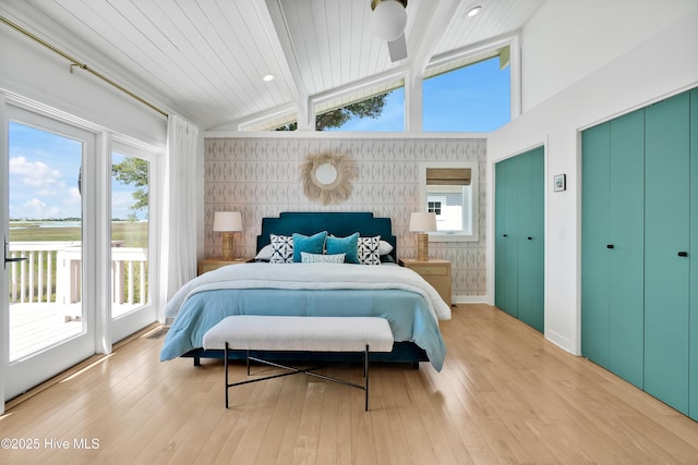 3343 Channelside Dr SW, Supply, NC 28462 - bedroom featuring an accent wall, access to outside, and light wood-style flooring