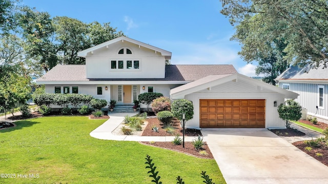 3343 Channelside Dr SW, Supply, NC 28462 - view of front of home with a front lawn, an attached garage, concrete driveway, and roof with shingles