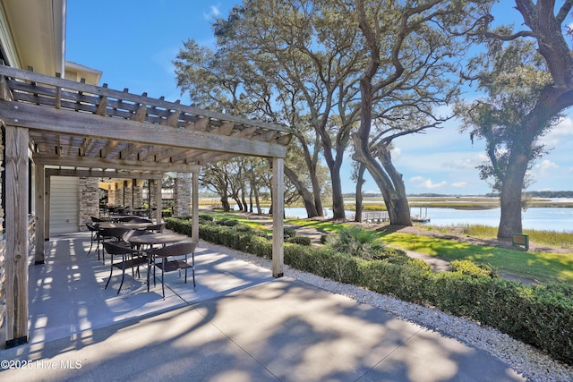 3343 Channelside Dr SW, Supply, NC 28462 - view of patio / terrace with a pergola, outdoor dining space, and a water view