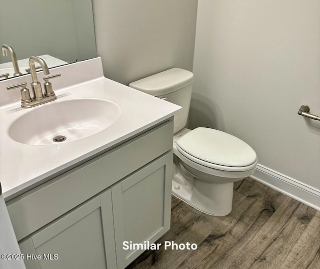 1822 Olde Towne Pointe Blvd, Jacksonville, NC 28546 - bathroom with wood finished floors, toilet, and vanity