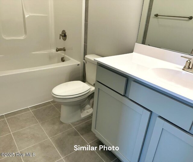 1822 Olde Towne Pointe Blvd, Jacksonville, NC 28546 - bathroom featuring tile patterned flooring, vanity, toilet, and tub / shower combination