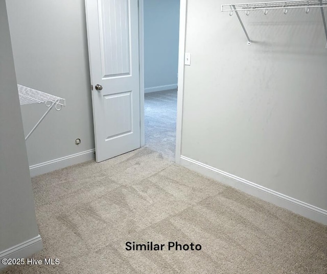 1822 Olde Towne Pointe Blvd, Jacksonville, NC 28546 - walk in closet featuring carpet