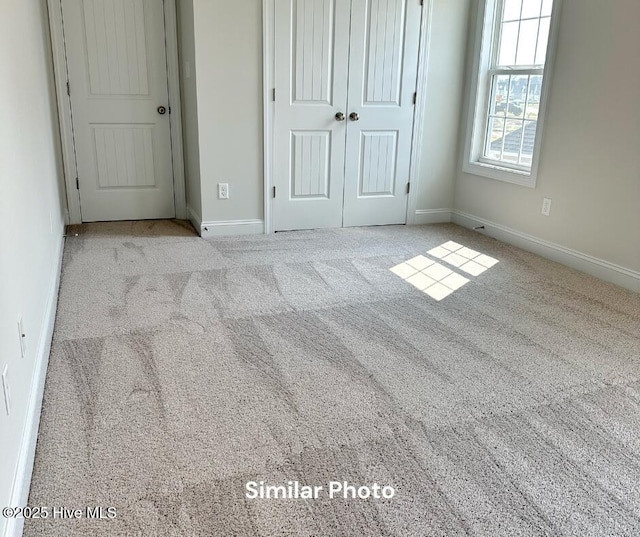 1822 Olde Towne Pointe Blvd, Jacksonville, NC 28546 - unfurnished bedroom with carpet, baseboards, and a closet