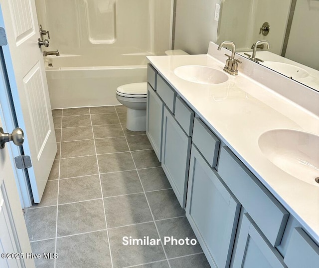 1822 Olde Towne Pointe Blvd, Jacksonville, NC 28546 - full bathroom with double vanity, tile patterned floors, toilet, and shower / bath combination