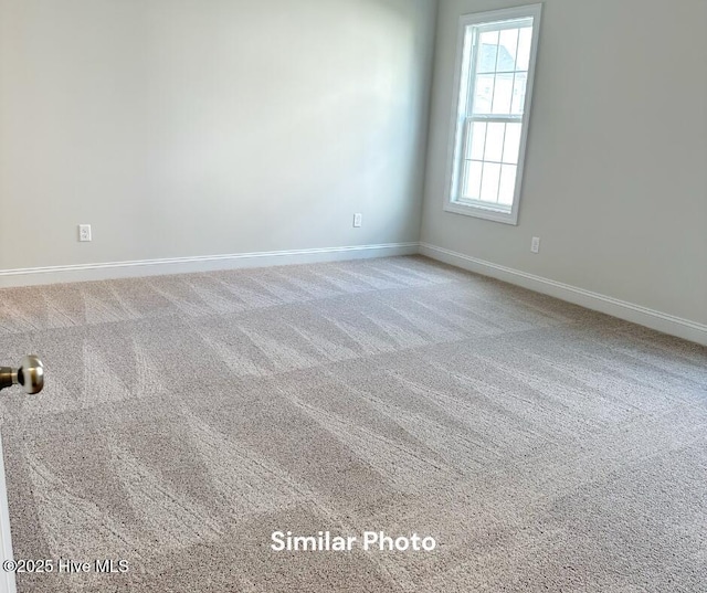 1822 Olde Towne Pointe Blvd, Jacksonville, NC 28546 - unfurnished room featuring plenty of natural light, baseboards, and carpet flooring