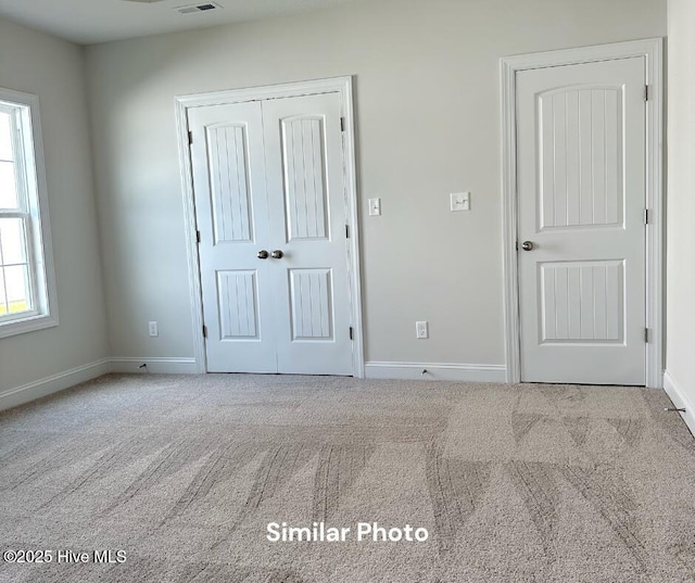 1822 Olde Towne Pointe Blvd, Jacksonville, NC 28546 - unfurnished bedroom with carpet flooring, baseboards, and a closet